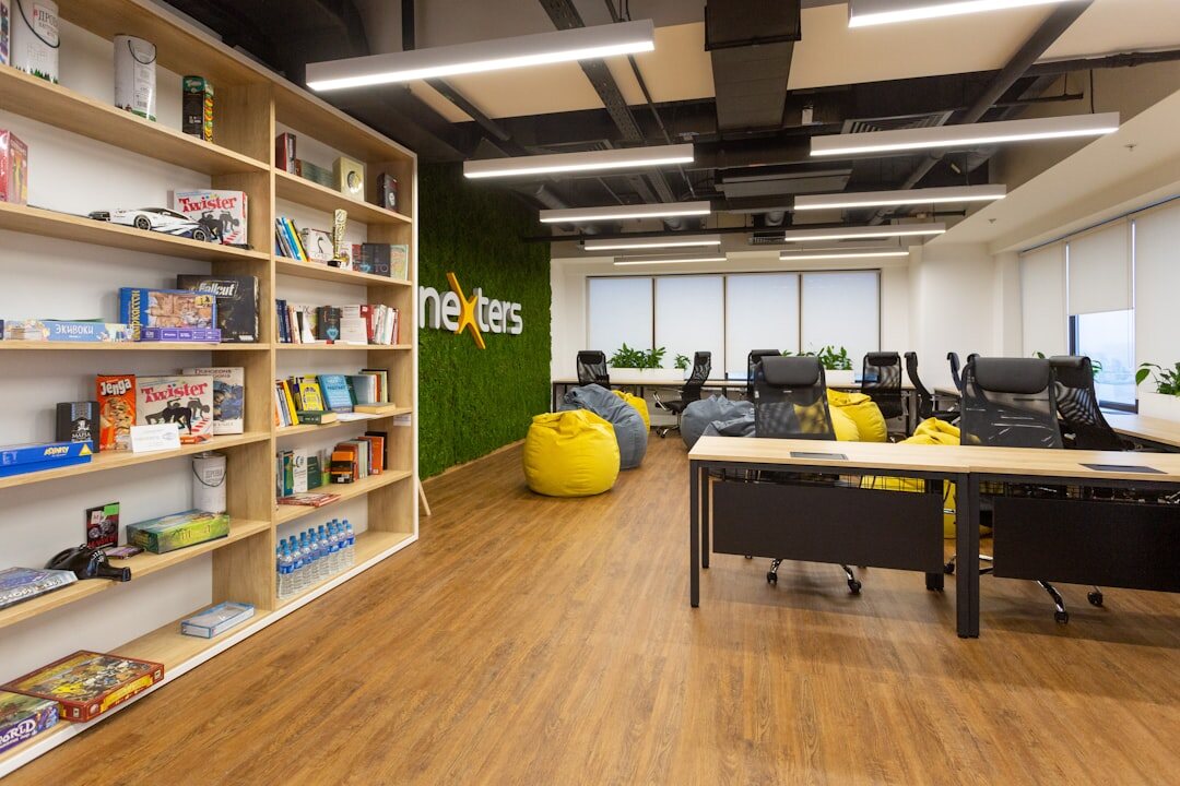 Busy newsroom office with journalists working at desks