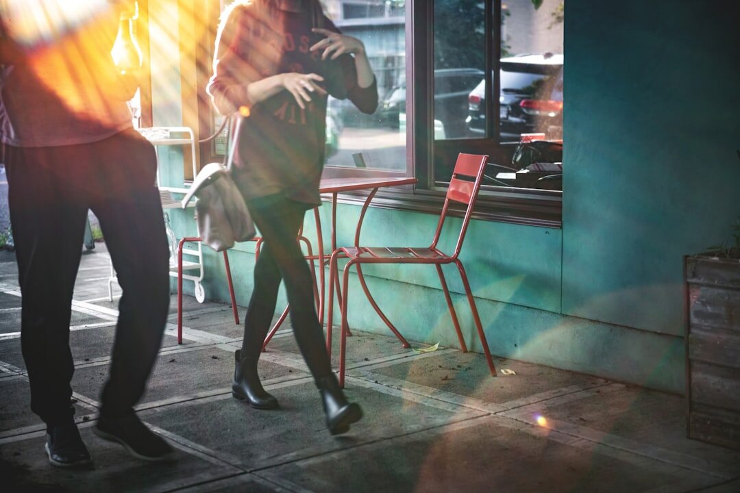 Paparazzi photo of a celebrity couple arguing outside a restaurant at night